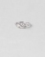 Round Cut Three Stone Engagement Ring — White gold