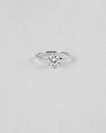 Round Cut Solitaire Engagement Ring — White gold