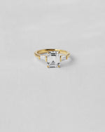 Emerald Cut Three Stone Engagement Ring